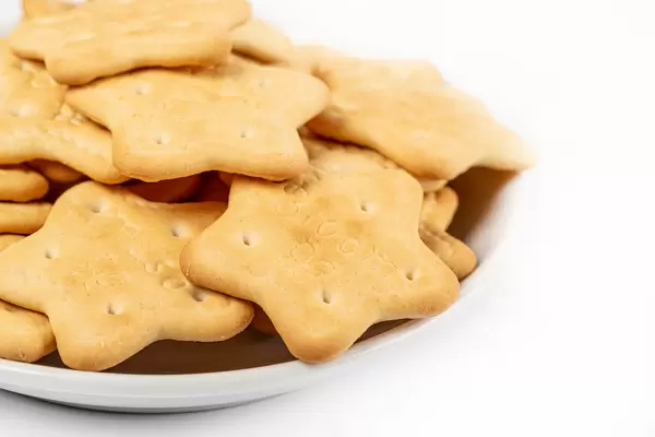 Star-shaped cookies on a white saucer