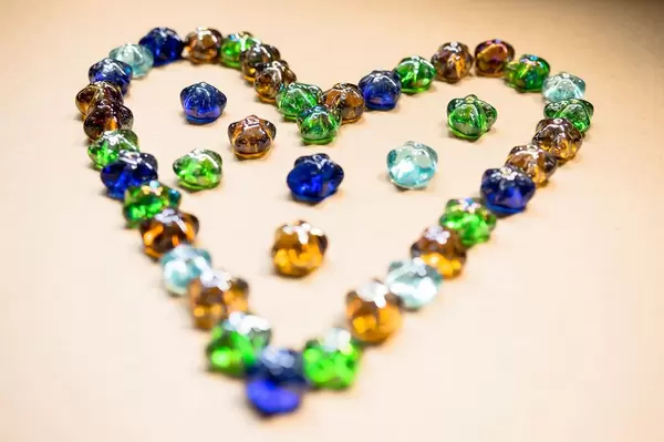 Star-shaped glass ornaments forming a heart