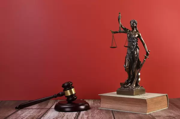 Statue of Lady Justice with Judge gavel