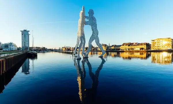 Statue of Molecule Man on river Spree