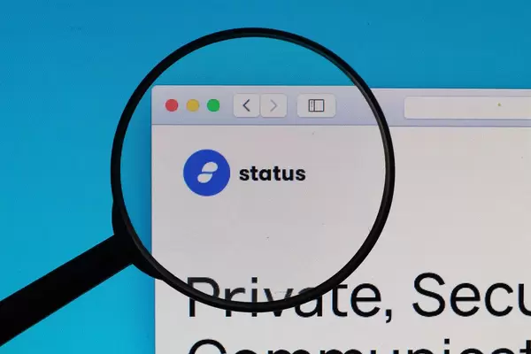 Status logo under magnifying glass