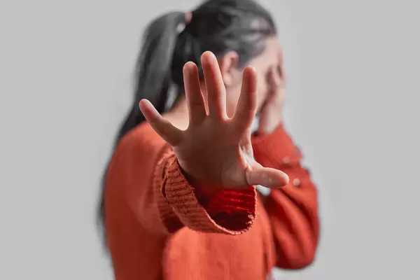 Stay Away - Women showing STOP gesture with hand