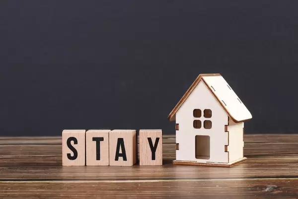 Stay home concept with wooden blocks
