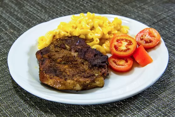 Steak with Macaronis and Tomatoes
