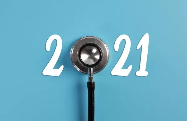 Stethoscope and 2021 text on blue background