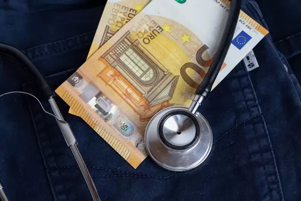 Stethoscope and banknotes