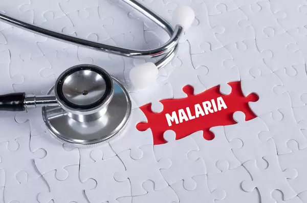 Stethoscope and missing puzzle with a Malaria text