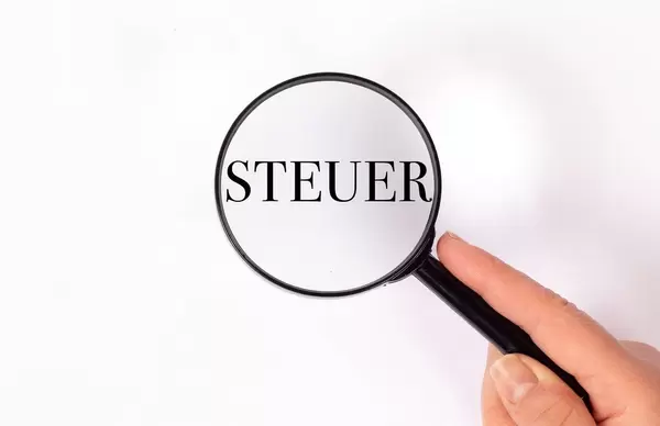 Steuer under magnifying glass