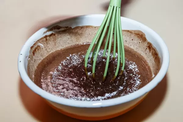 Stirring chocolate pastry for fondant cake (Flip 2019)