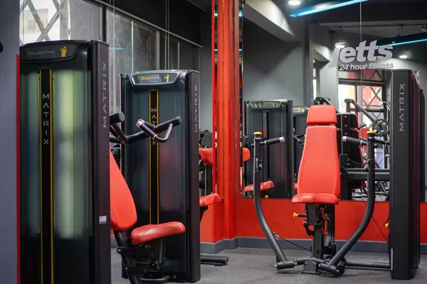 Straight Chest Press Machine, Biceps Curl Machine and Shoulder Press Machine in a modern Fitness Centre