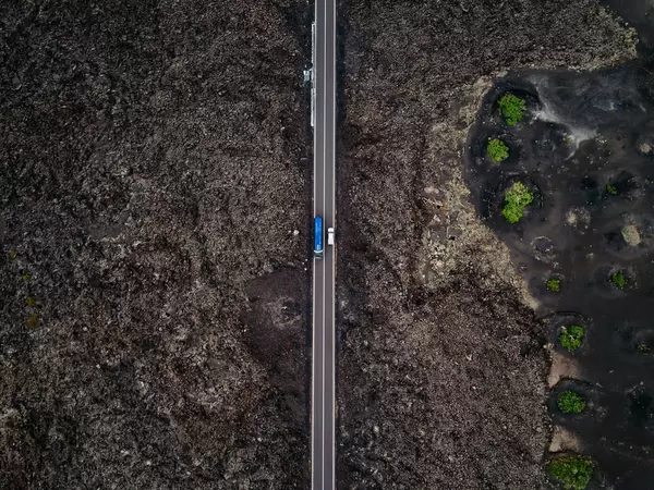 Straight road through a rocky landscape / Geradeaus durch eine felsige Landschaft