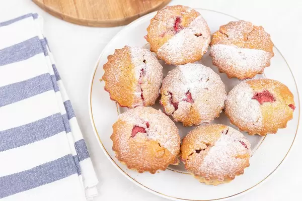 Strawberry Cupcakes served on the plate with powder sugar