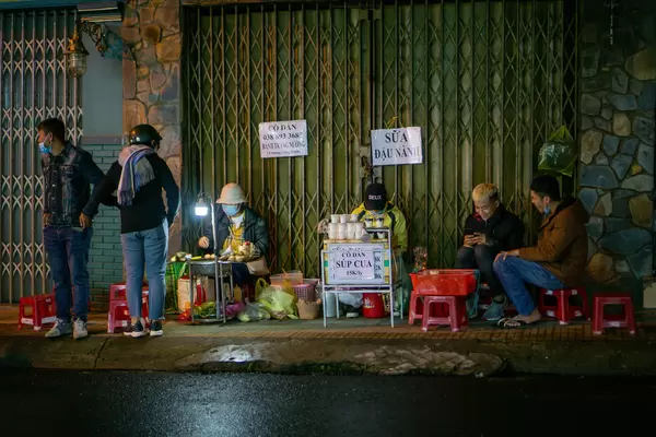 Street Food Vendors selling Hot Soy Milk and Grilled Rice Paper in Dalat, Vietnam