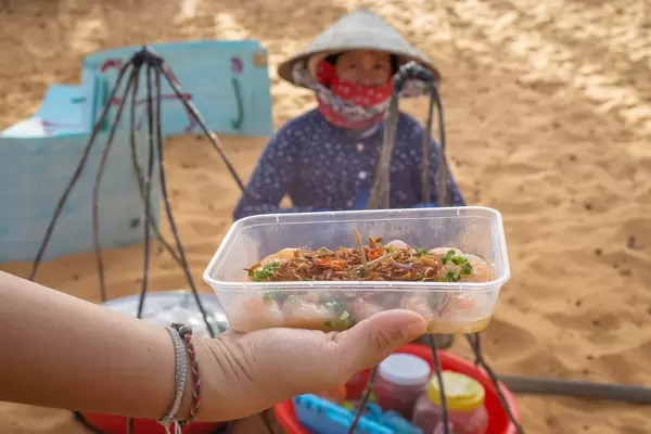 Streetfood Snacks in front of the Red Sand Dunes in Mui Ne, Vietnam  Flip 2019