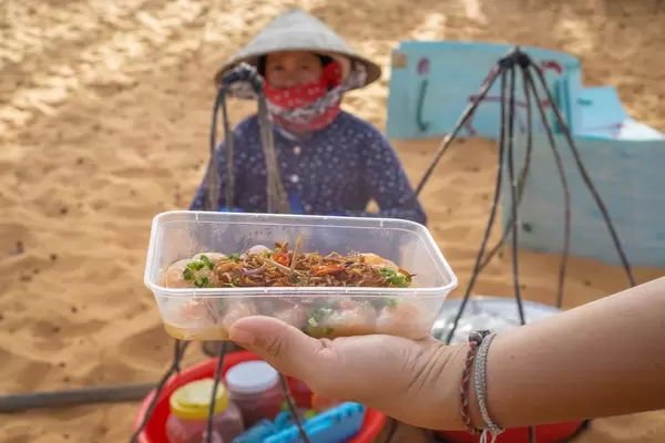 Streetfood Snacks in front of the Red Sand Dunes in Mui Ne, Vietnam