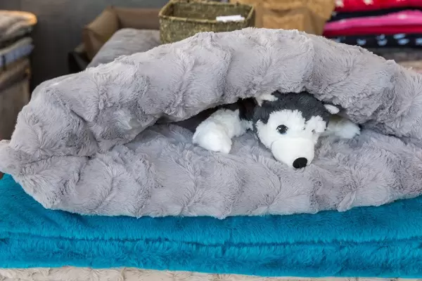 Stuffed Animal in a slip bag/snuggle pad "Schlupfsack" - dog basket at the dog fair "Hundemesse 2019" in Cologne, Germany