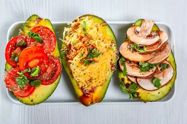 Stuffed avocado with different fillings