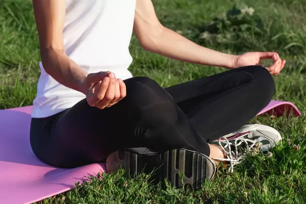 Sukhasana - Comfortable or Easy yoga pose in nature, close-up