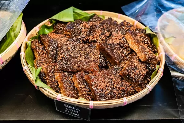 Suman with latik toppings on display