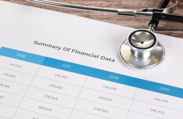 Summary Of Financial Data document with stethoscope