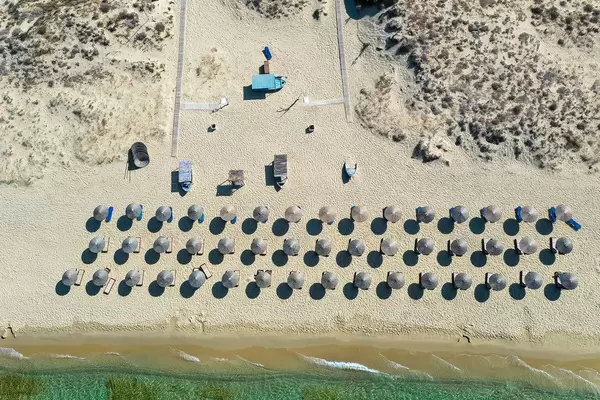 Summer 2020, holiday on the empty beach of Plaka with no tourists. Aerial view of Greek island of Naxos