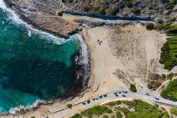 Summer 2020 in Majorca with almost empty, wild beaches: Cala Mitjana, overhead drone photo