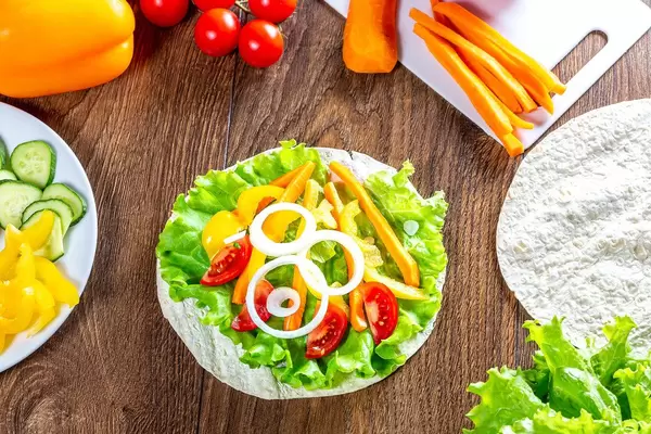Summer ripe vegetables and pita on wooden background (Flip 2019)