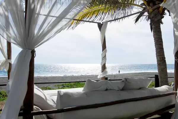 Sunbed with a beautiful view of a tropical beach