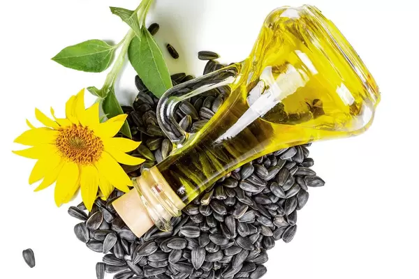 Sunflower oil and sunflower seeds, top view