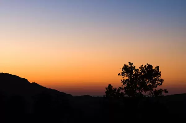 Sunrise colors behind the hills