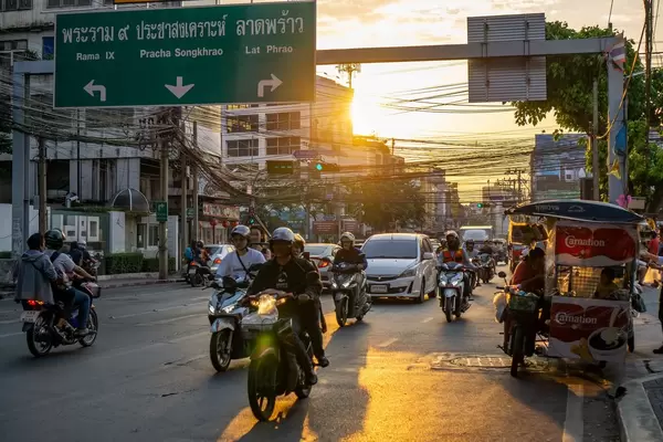 Sunset in Bangkok, Thailand with Reflection on the Street