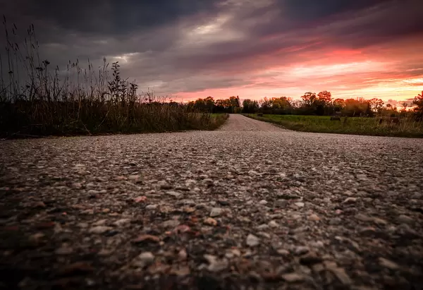 Sunset Landscape And Countryside Road With Meadows