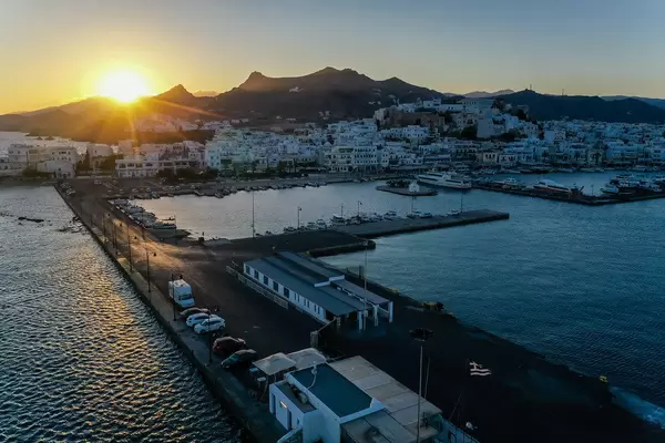 Sunset over the port and main town of Naxos, Chora. Drone photo