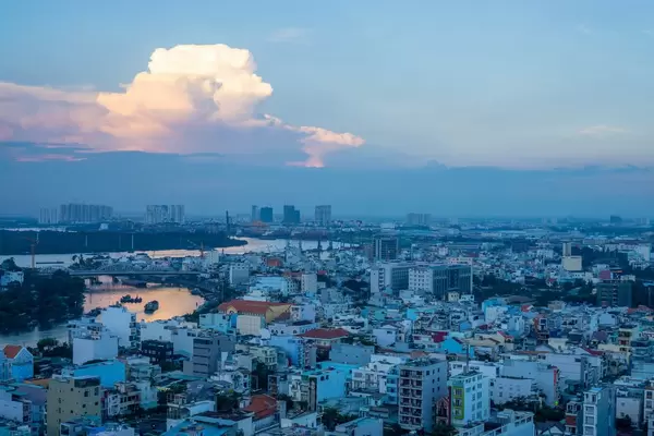 Sunset View of Ho Chi Minh City with Sun Reflection in the Water