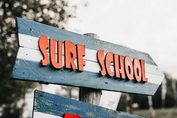 Surf school wooden sight. Outdoor background