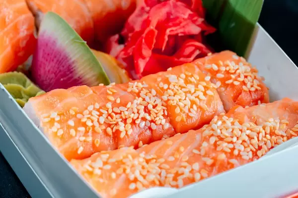 Sushi in a box with wasabi and pickled ginger