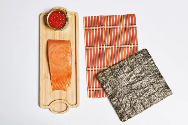 Sushi ingredients on white surface