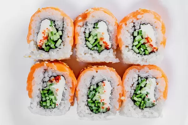 Sushi rolls philadelphia on a white plate. Top view