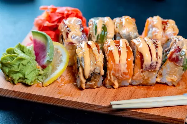 Sushi with chopsticks.