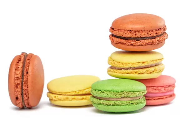 Sweet and colourful french macaroons on white background