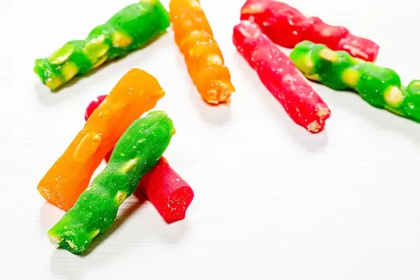 Sweet delicious churchkhela on wooden white background (Flip 2019)