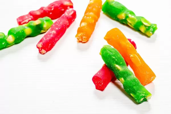 Sweet delicious churchkhela on wooden white background