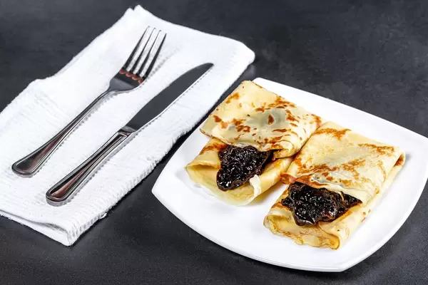 Sweet homemade pancakes with jam and Cutlery (Flip 2019)