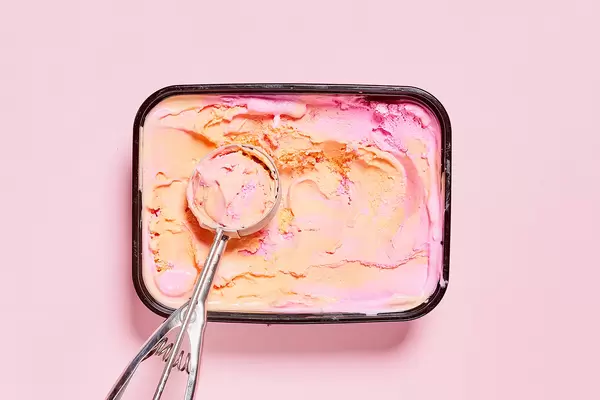 Sweet ice cream scooped out of container