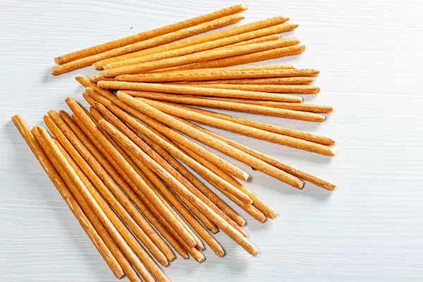 Sweet straw cracker cookies on white table (Flip 2019)