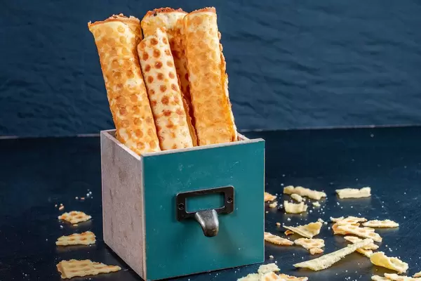 Sweet wafer rolls on dark background (Flip 2019)