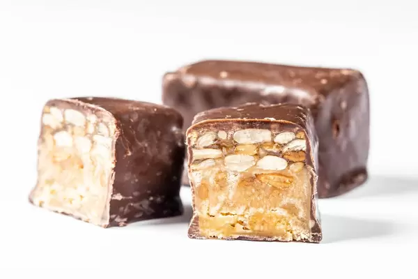 Sweets with sunflower seeds in milk chocolate close-up