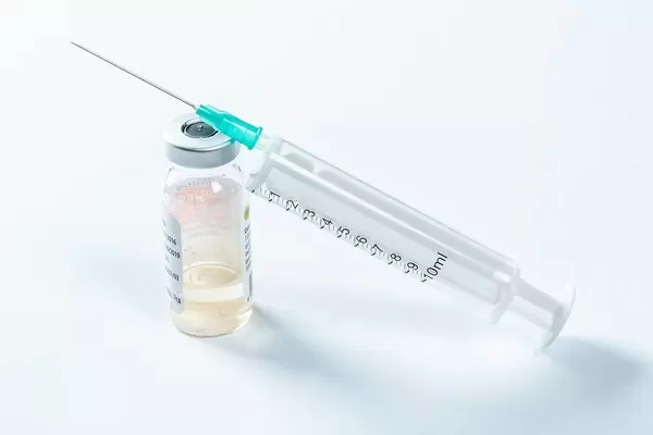 Syringe and liquid in a tiny bottle