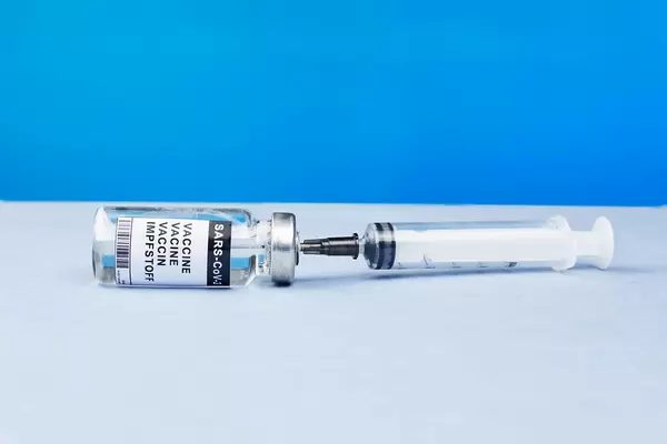 Syringe and vial of vaccine for flu, covid-19, measles or other diseases