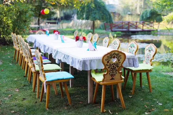 Table and chairs arranged for outdoor children party